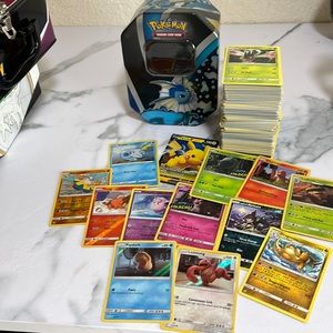 Pokemon TCG bulk 350 card lot with collectors metal tin and holos.